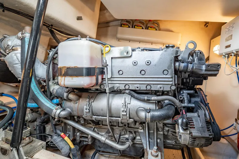 Slide: The Image of Engine room of a 2004 Luhrs 32 Open boat, showcasing detailed machinery components. - 86