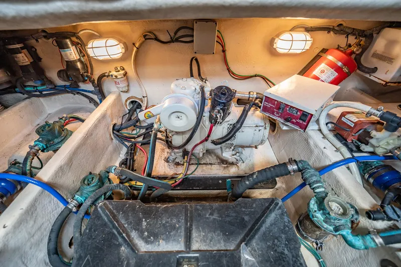 Slide: The Image of Engine room of 2004 Luhrs 32 Open boat, showcasing mechanical components and wiring. - 88