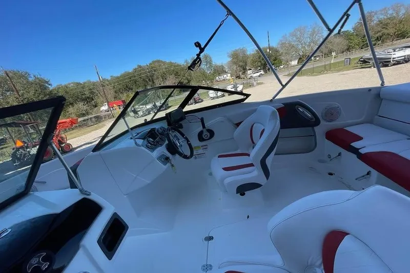 Slide: The Image of Interior of a 2018 Tahoe 500 TF boat with white and red seating. - 5