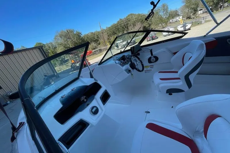 Slide: The Image of Interior of a 2018 Tahoe 500 TF boat with white and red seating. - 6