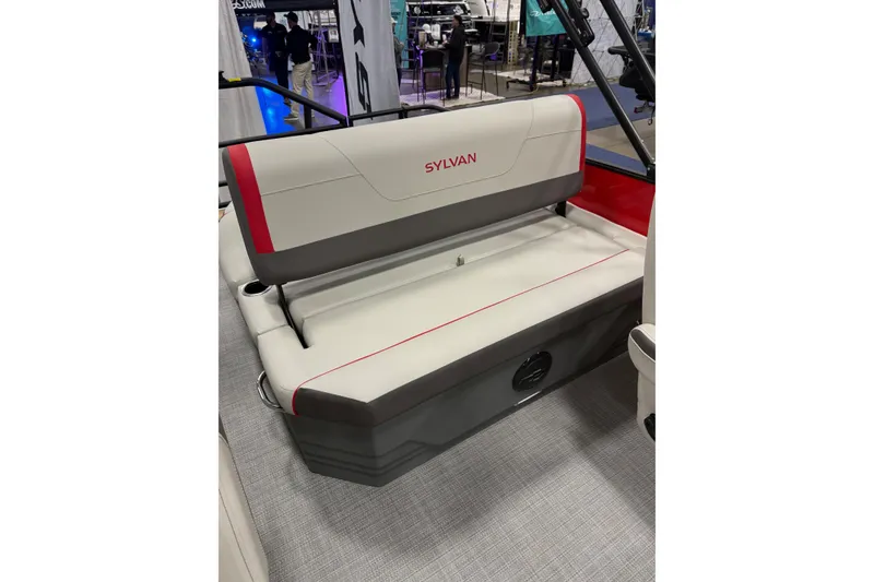 Slide: The Image of 2026 Sylvan Mirage X X1 CLZ DH boat seat with red accents at a showroom. - 10