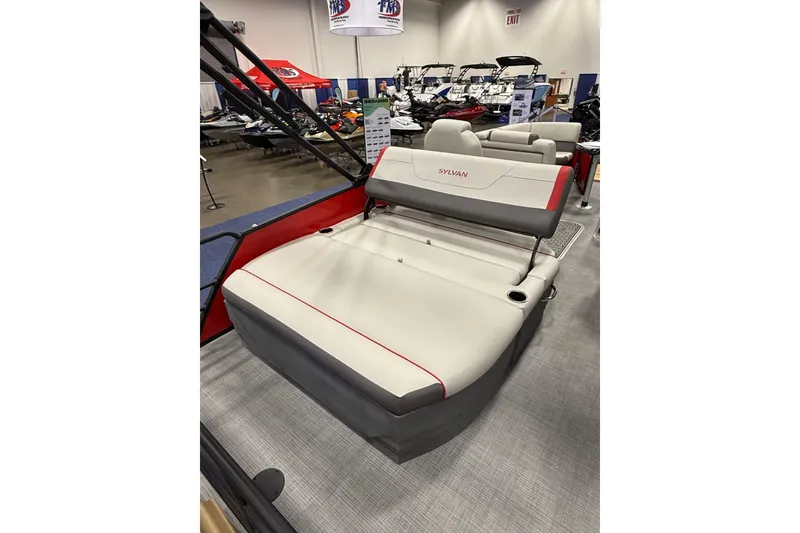 Slide: The Image of 2026 Sylvan Mirage X X1 CLZ DH pontoon boat interior with stylish seating at a boat show. - 12