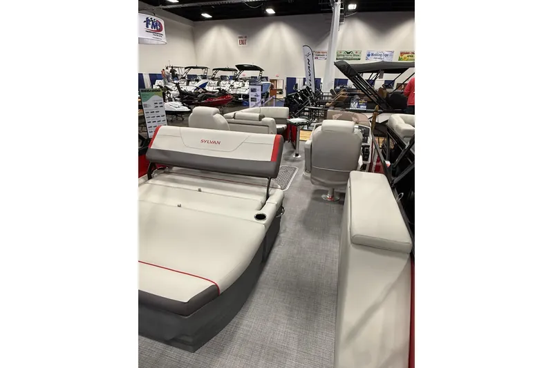 Slide: The Image of 2026 Sylvan Mirage X X1 CLZ DH pontoon boat interior at a boat show. - 13