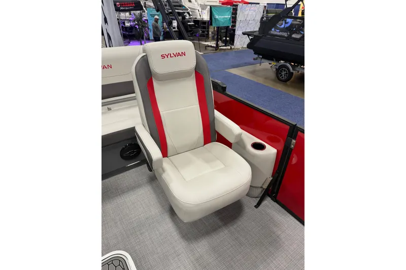 Slide: The Image of Luxurious Sylvan Mirage X X1 CLZ DH 2026 boat seat with red accents and cup holder. - 6