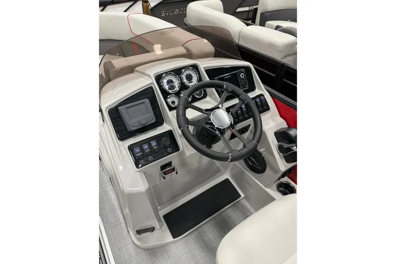 Slide: The Image of 2026 Sylvan Mirage X X1 CLZ DH boat dashboard with steering wheel and controls. - 8