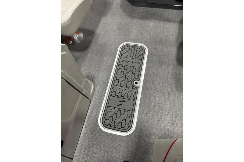 Slide: The Image of Floor hatch of 2026 Sylvan Mirage X X1 CLZ DH boat, featuring hexagonal pattern. - 9