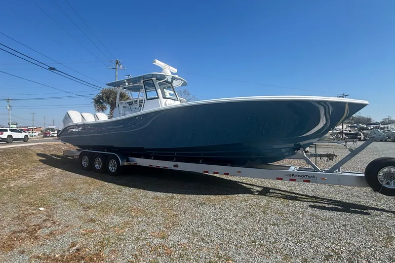 The Image of 2026 Yellowfin 36 Offshore boat on trailer under clear blue sky. - 0