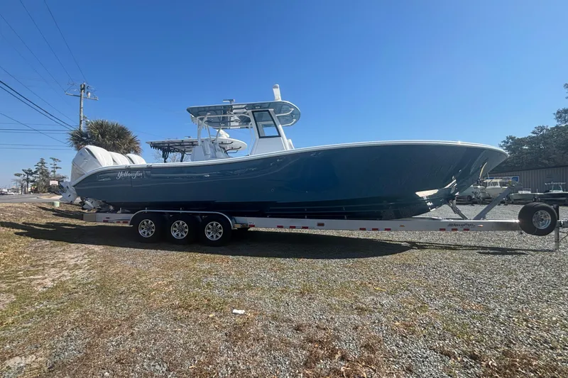 Slide: The Image of 2026 Yellowfin 36 Offshore boat on trailer under clear blue sky. - 1