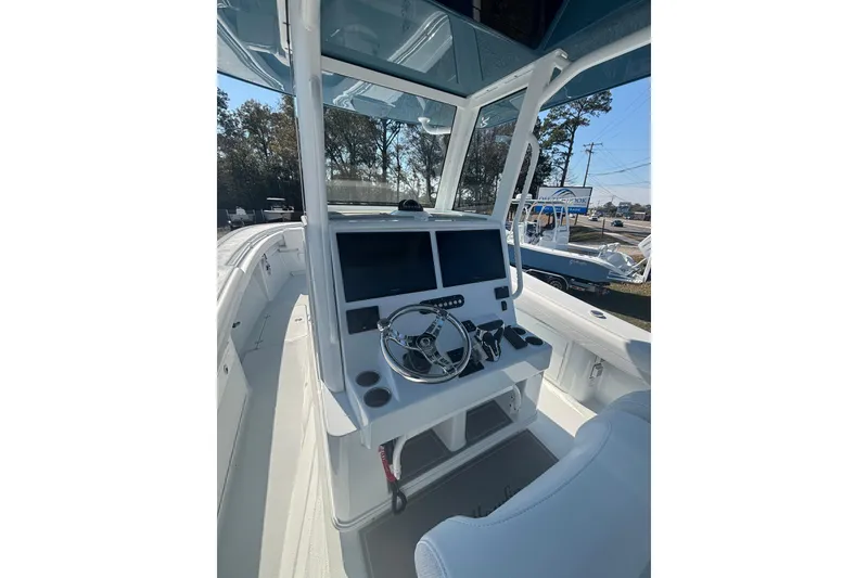 Slide: The Image of 2026 Yellowfin 36 Offshore boat cockpit with modern steering and navigation system. - 14