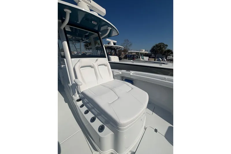 Slide: The Image of 2026 Yellowfin 36 Offshore boat with white seating and sleek design. - 16