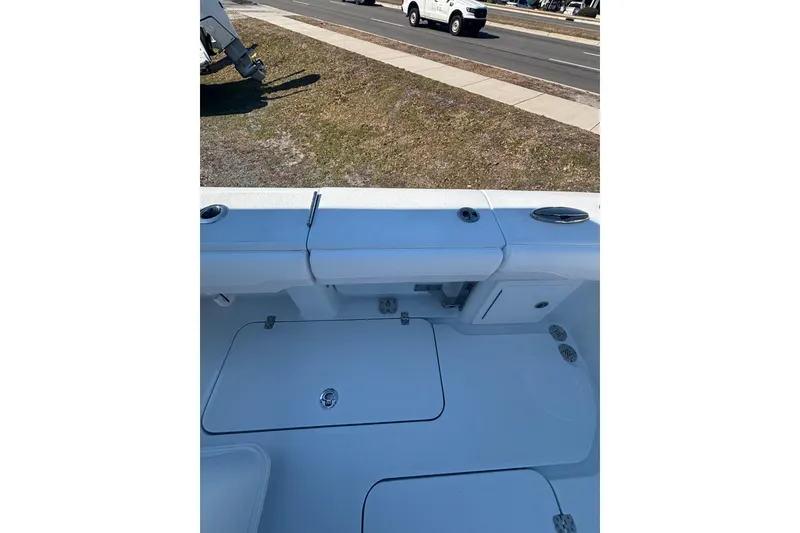 Slide: The Image of 2026 Yellowfin 36 Offshore boat interior with storage compartments and rod holders. - 22