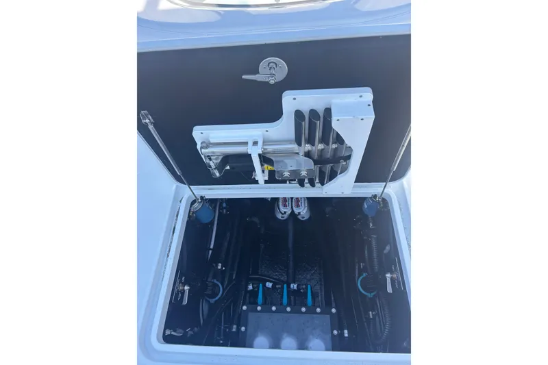 Slide: The Image of 2026 Yellowfin 36 Offshore boat storage compartment with organized equipment and tools. - 25