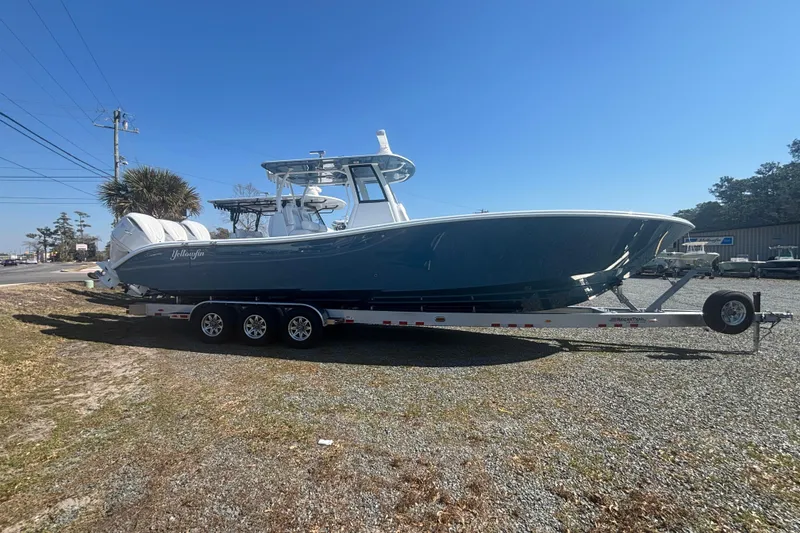 Slide: The Image of 2026 Yellowfin 36 Offshore boat on trailer under clear blue sky. - 5