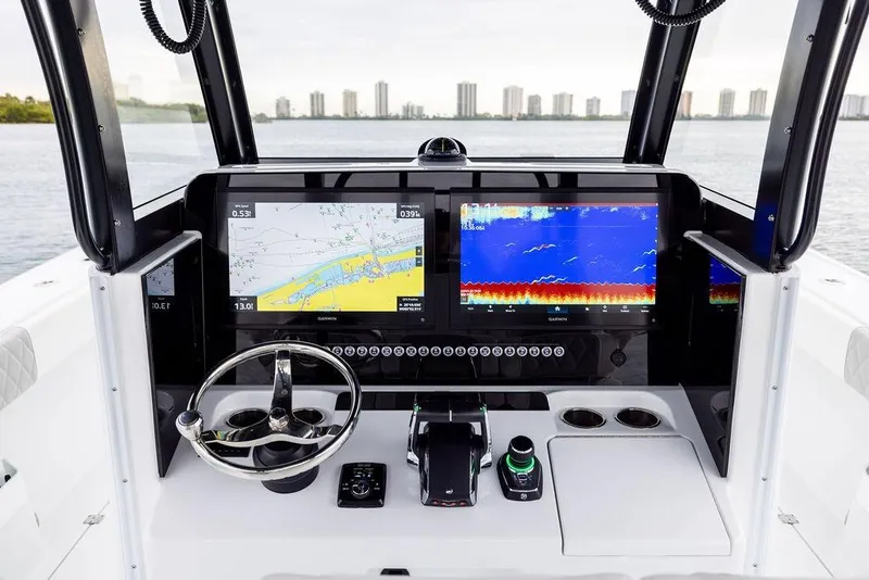 Slide: The Image of Freeman 38 boat dashboard with advanced navigation screens, 2025 model. - 15