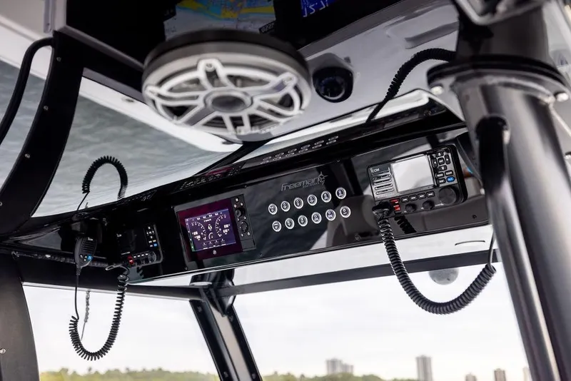 Slide: The Image of 2025 Freeman 38 boat dashboard with advanced controls and communication systems. - 17