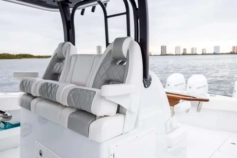 Slide: The Image of Luxury seating on 2025 Freeman 38 boat with ocean view and city skyline. - 19