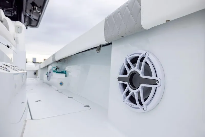 Slide: The Image of 2025 Freeman 38 boat interior with speaker and cushioned seating detail. - 21
