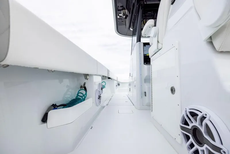 Slide: The Image of 2025 Freeman 38 boat interior with white seating and storage compartments. - 23