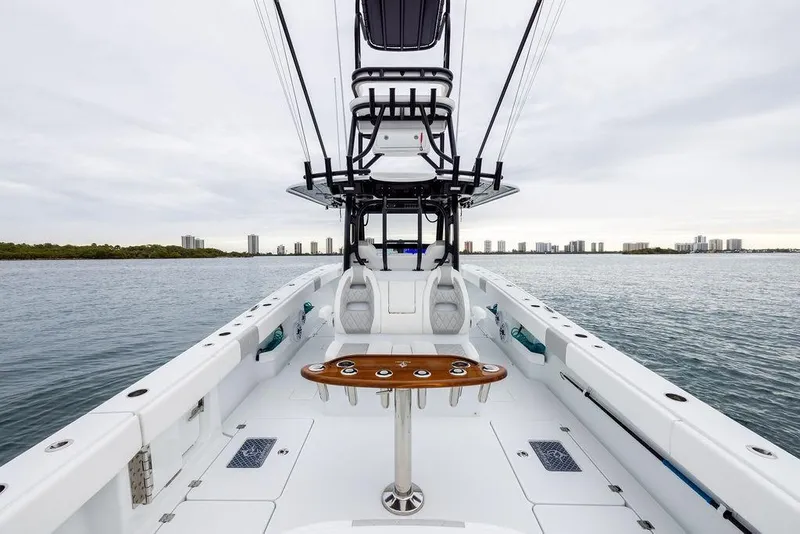 Slide: The Image of 2025 Freeman 38 boat on water, featuring spacious deck and modern design. - 24