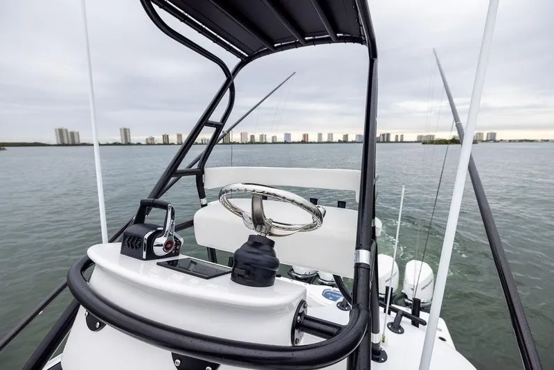 Slide: The Image of 2025 Freeman 38 boat helm with city skyline in the background. - 27