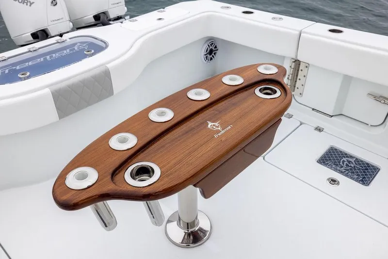 Slide: The Image of Luxury Freeman 38 boat interior with wooden rod holder, 2025 model. - 32