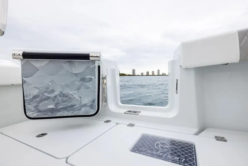 Slide: The Image of Freeman 38 boat interior, 2025 model, with ocean view and city skyline. - 33