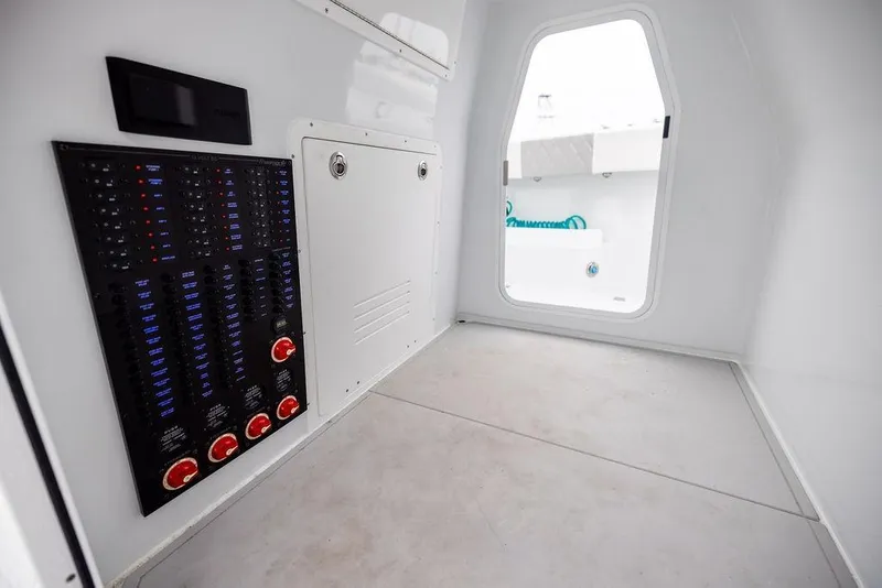 Slide: The Image of Interior of 2025 Freeman 38 boat showing control panel and cabin door. - 35