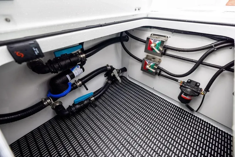 Slide: The Image of Freeman 38 (2025) boat compartment with wiring and control panels. - 37