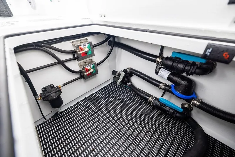 Slide: The Image of Freeman 38 (2025) boat compartment with wiring and plumbing components. - 39