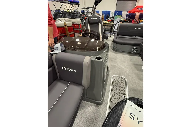 Slide: The Image of 2026 Sylvan Mirage X X3 CLZ DH pontoon boat interior at a boat show. - 13