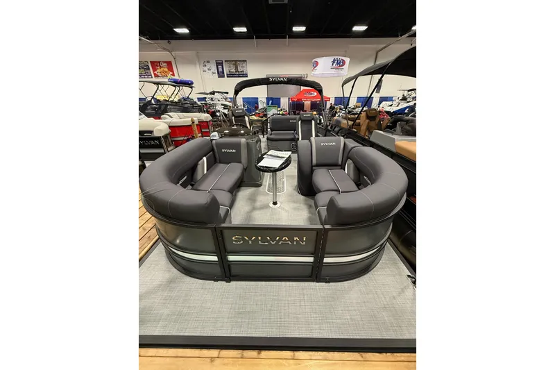 Slide: The Image of 2026 Sylvan Mirage X X3 CLZ DH pontoon boat with luxurious seating and modern design. - 2