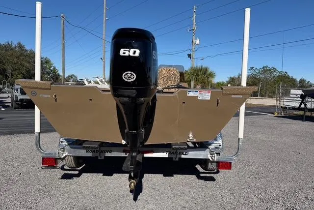 Slide: The Image of 2026 Smoker Craft Pro Sportsman 1660 boat with 60 HP motor on trailer. - 10