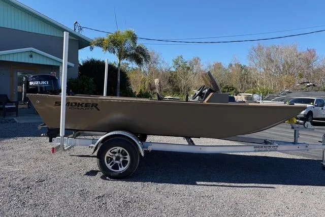 Slide: The Image of 2026 Smoker Craft Pro Sportsman 1660 boat on trailer, parked outdoors. - 4