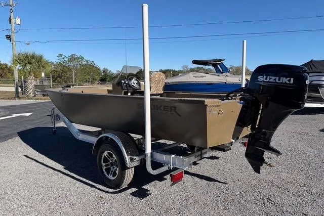 Slide: The Image of 2026 Smoker Craft Pro Sportsman 1660 boat with Suzuki outboard motor on trailer. - 9