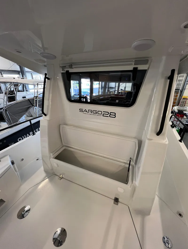 Slide: The Image of Sargo 28 boat interior, 2024 model, showcasing storage compartment and sleek design. - 11