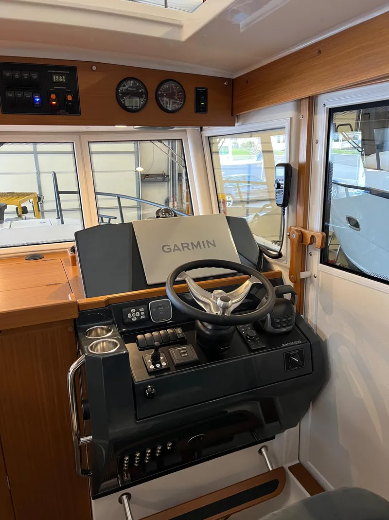 Slide: The Image of Interior helm of 2024 Sargo 28 boat with Garmin navigation system. - 14