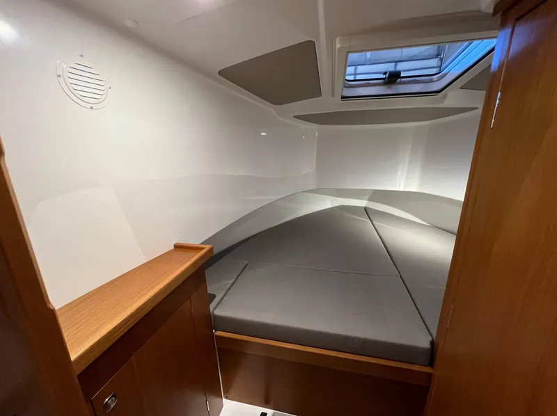 Slide: The Image of Interior cabin of 2024 Sargo 28 boat with bed and skylight. - 19