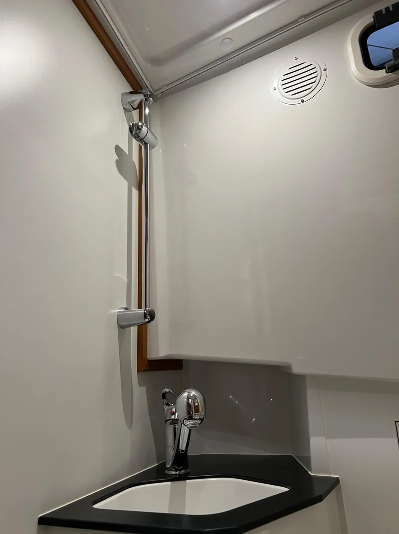 Slide: The Image of 2024 Sargo 28 boat bathroom with modern fixtures and sleek design. - 23