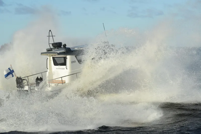 Slide: The Image of Sargo 28 boat navigating rough waters, 2024 model. - 35