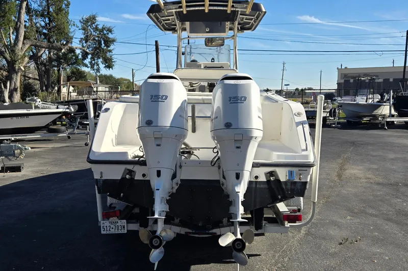 Slide: The Image of 2006 Century 2400 Center Console boat with twin 150 horsepower outboard engines. - 4