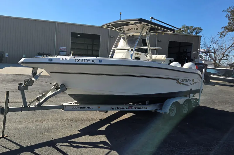 Slide: The Image of 2006 Century 2400 Center Console boat on trailer outside a warehouse. - 7