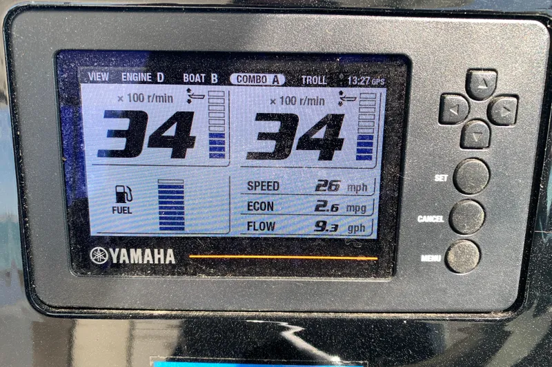 Slide: The Image of Yamaha display on 2023 Pursuit DC 266 Dual Console showing engine stats and fuel efficiency. - 13