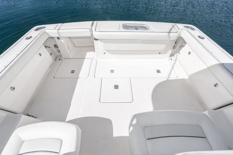 Slide: The Image of 2005 Tiara Yachts 3600 Open, spacious cockpit with white upholstery. - 10