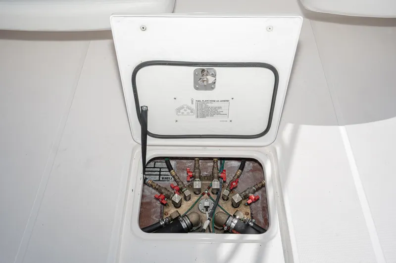 Slide: The Image of 2005 Tiara Yachts 3600 Open access hatch with valves and hoses. - 16