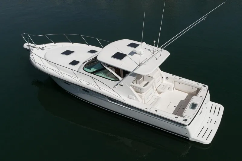 Slide: The Image of 2005 Tiara Yachts 3600 Open, luxury white yacht on calm water. - 2