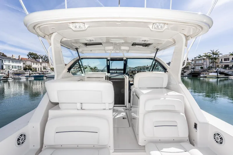 Slide: The Image of Interior view of 2005 Tiara Yachts 3600 Open, luxurious boat canopy and seating. - 21