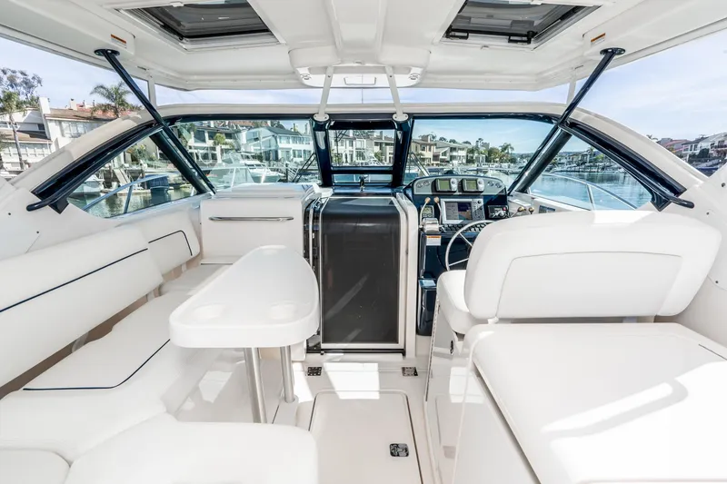 Slide: The Image of Interior of a 2005 Tiara Yachts 3600 Open with white seating. - 22