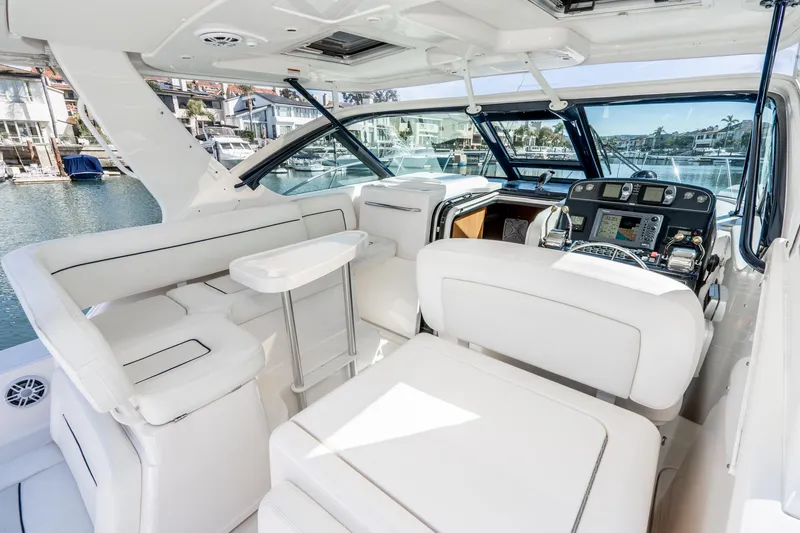 Slide: The Image of Interior of a 2005 Tiara Yachts 3600 Open with luxurious white seating. - 30