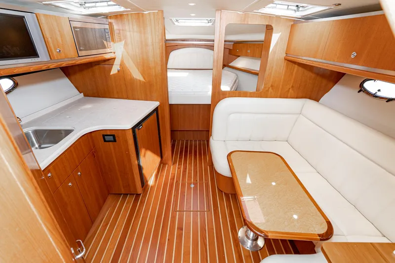 Slide: The Image of 2005 Tiara Yachts 3600 Open interior with wood finish and seating. - 37