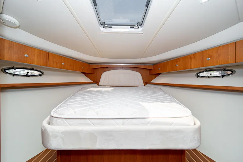 Slide: The Image of Interior of 2005 Tiara Yachts 3600 Open with bed and wood paneling. - 39